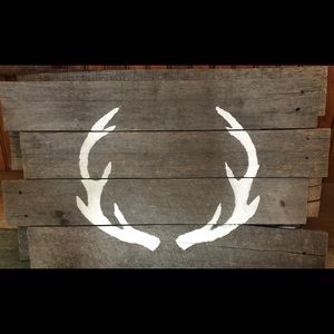 Wooden sign with horns